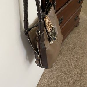 A Fashionista bag, 12”width, 9”length, handle 10”, sides unzip for extra room.